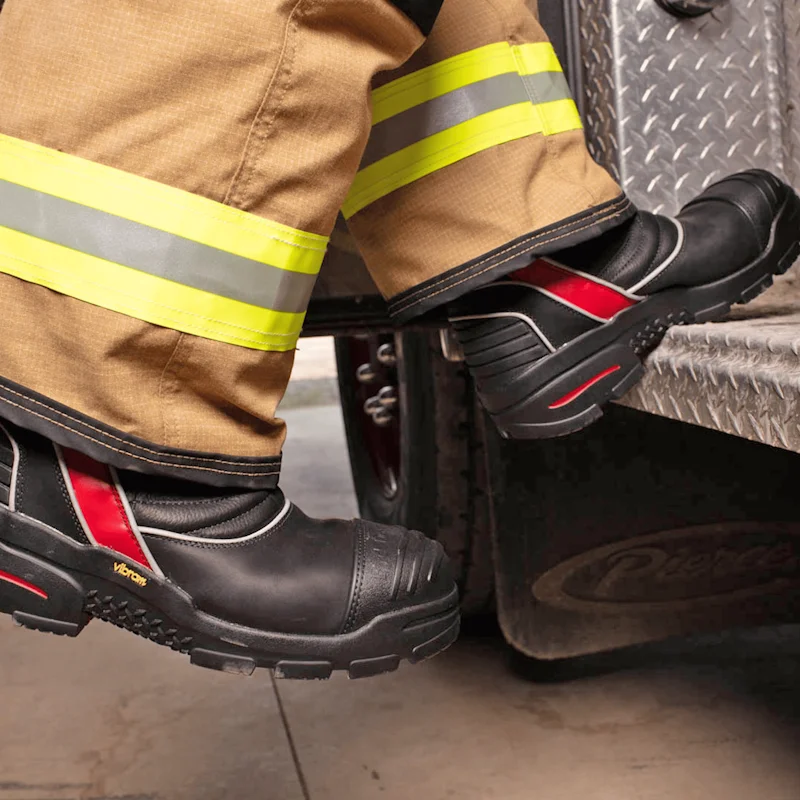 Close-up of a firefighter wearing Fire-Dex® FDXL200 Leather Firefighter Boots, highlighting fit, protective features, and ergonomic design in use.