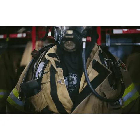 Close-up of a single firefighter wearing the Fire-Dex® Captain Jim Particulate Blocking Hood, highlighting hood fit, full coverage, and material texture.