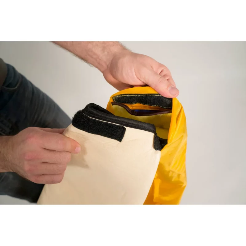 Close-up of foam liner’s Velcro attachment inside sleeve area of Mustang Survival® Ice Commander Rescue Suit for secure fit.
