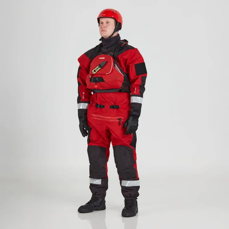 Front side view of a man wearing the NRS Ascent SAR Dry Suit in red with an equipment bag on the chest, showcasing the waterproof material and rescue gear readiness.