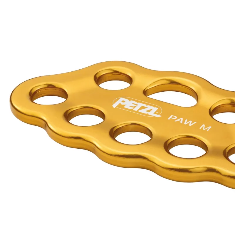 Closeup of the yellow Petzl® PAW Rigging Plate with 8 connection holes, highlighting its durable construction for organizing rope systems in climbing, rescue, and rigging setups.