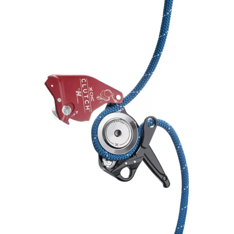 Top view of the red Harken™ CMC CLUTCH™ in the open position with rope loaded, illustrating proper rope routing and internal mechanism for safe and efficient use in rescue and rope access applications.