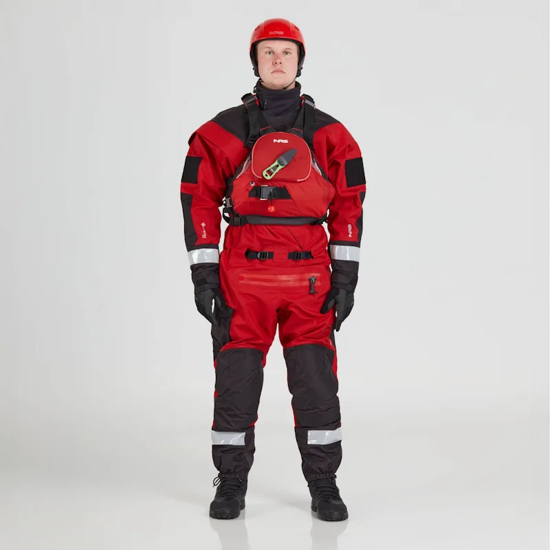 Front view of a man wearing the NRS Ascent SAR Dry Suit in red with an equipment bag secured on the chest, highlighting the suit’s waterproof fabric and rescue gear setup.
