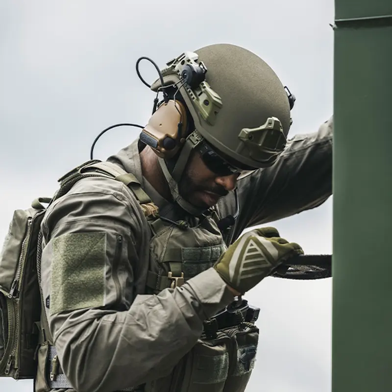 Soldier wearing the Team Wendy® EPIC™ Protector Ballistic Helmet while climbing down a structure, showing its secure fit, comfort, and reliability during active operations.