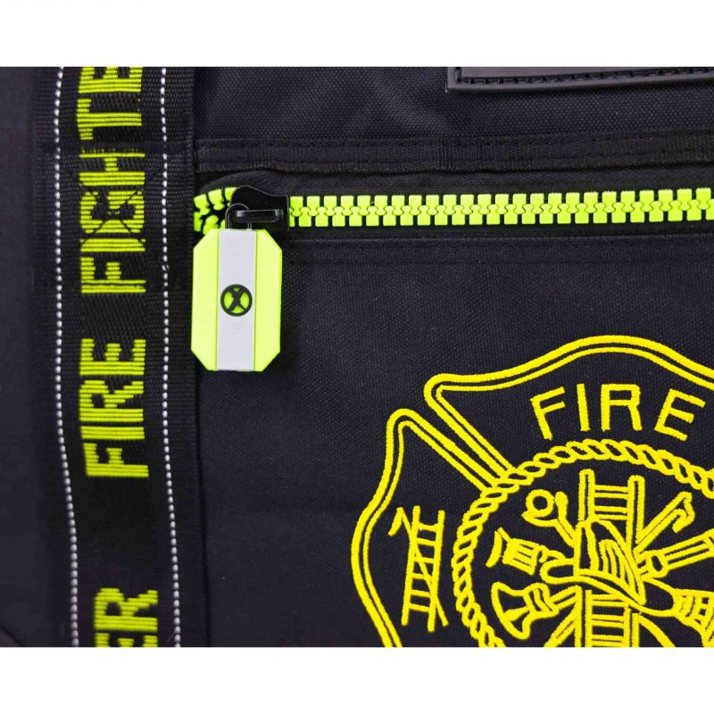 Closeup of front zipper near medical emblem on Lightning X LXFB10 black variant, displaying smooth, durable hardware.