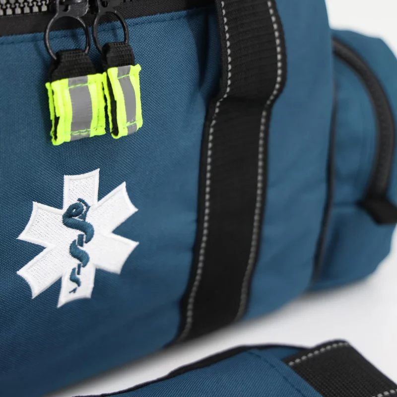 Closeup of medical emblem on Lightning X LXMB30 navy blue variant, displaying clear identification for emergency use.