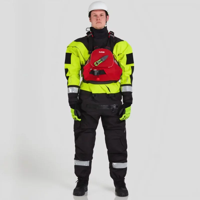 Front view of a man wearing the NRS Ascent SAR Dry Suit in safety yellow with a red equipment bag secured on the chest, highlighting the suit’s waterproof fabric and rescue gear setup.