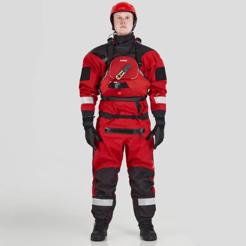 Front view of a man wearing the NRS Ascent SAR Dry Suit in red with a red equipment bag secured on the chest, highlighting the suit’s waterproof fabric and rescue gear setup.