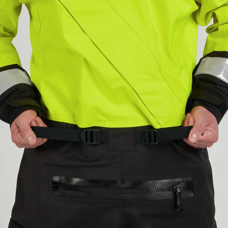 Closeup of a man wearing the NRS Ascent SAR Dry Suit in safety yellow, gripping the adjustable waist straps for a secure fit.