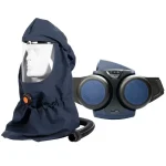 Sundström® SR 500/SR 530 powered air purifying respirator system in navy blue, featuring a soft fabric hood with a clear face shield, orange air flow connector, and breathing hose on a mannequin head beside the belt-worn blower unit with dual round filters and adjustable waist strap.