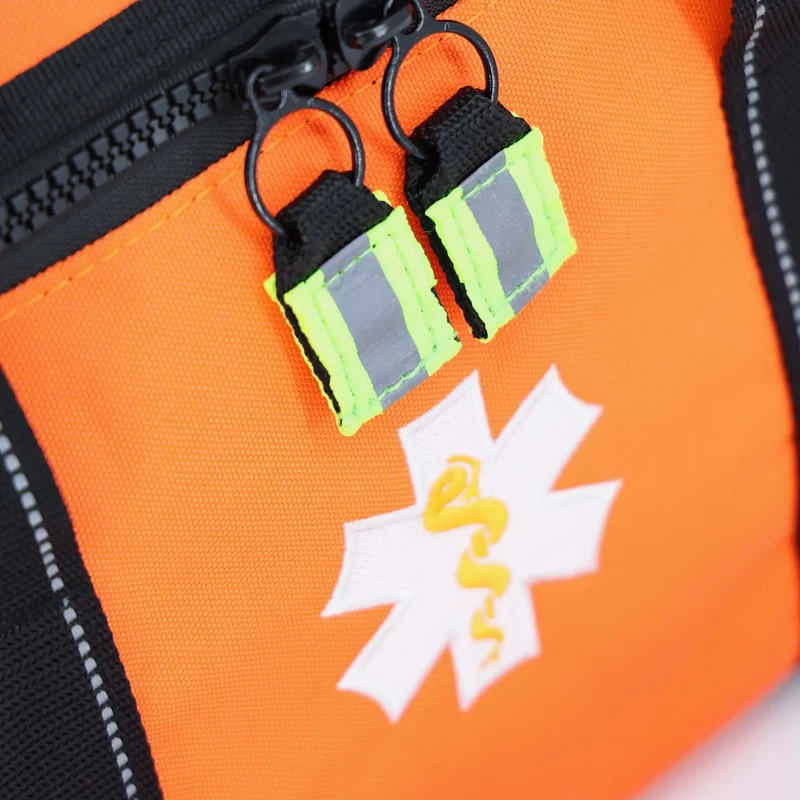 Closeup of medical emblem on Lightning X LXMB30 orange variant, displaying clear identification for emergency use.