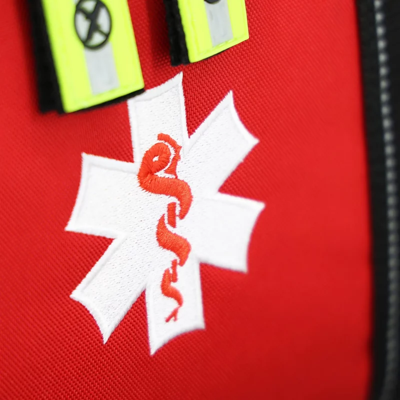 Closeup of medical emblem on Lightning X LXMB30 red variant, displaying clear identification for emergency use.