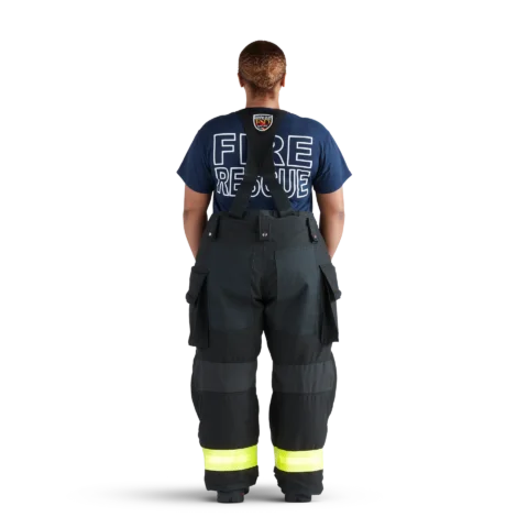 Back view of firefighter wearing black Fire-Dex® AeroFlex™ turnout gear, highlighting reflective striping and durable fabric for enhanced visibility and safety.