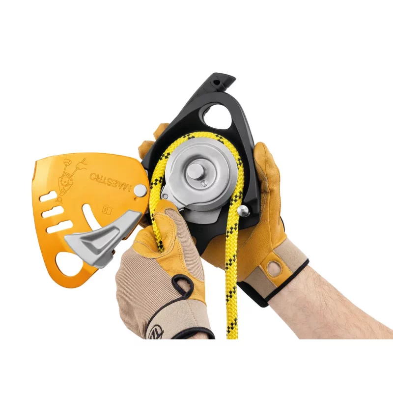 Petzl® MAESTRO® S Descender in use with rope fed and front flipped open, demonstrating controlled rope management for rescue and descent operations.