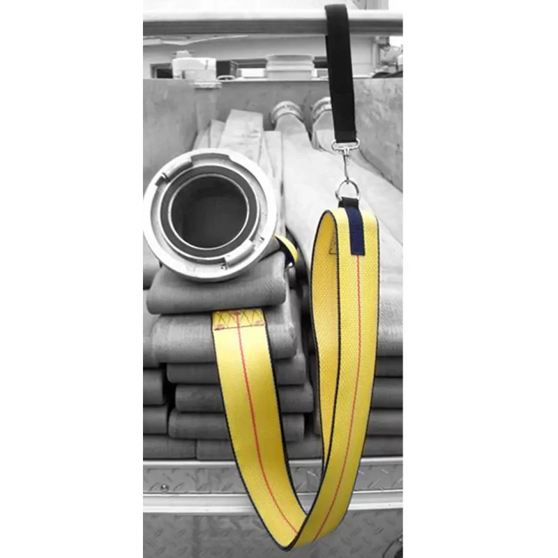 R&B Fabrications LDH-01YL Large Diameter Hose Strap hooked to a folded fire hose, showing its durable, quick-release design for efficient transport and deployment of large diameter hose in fireground operations.