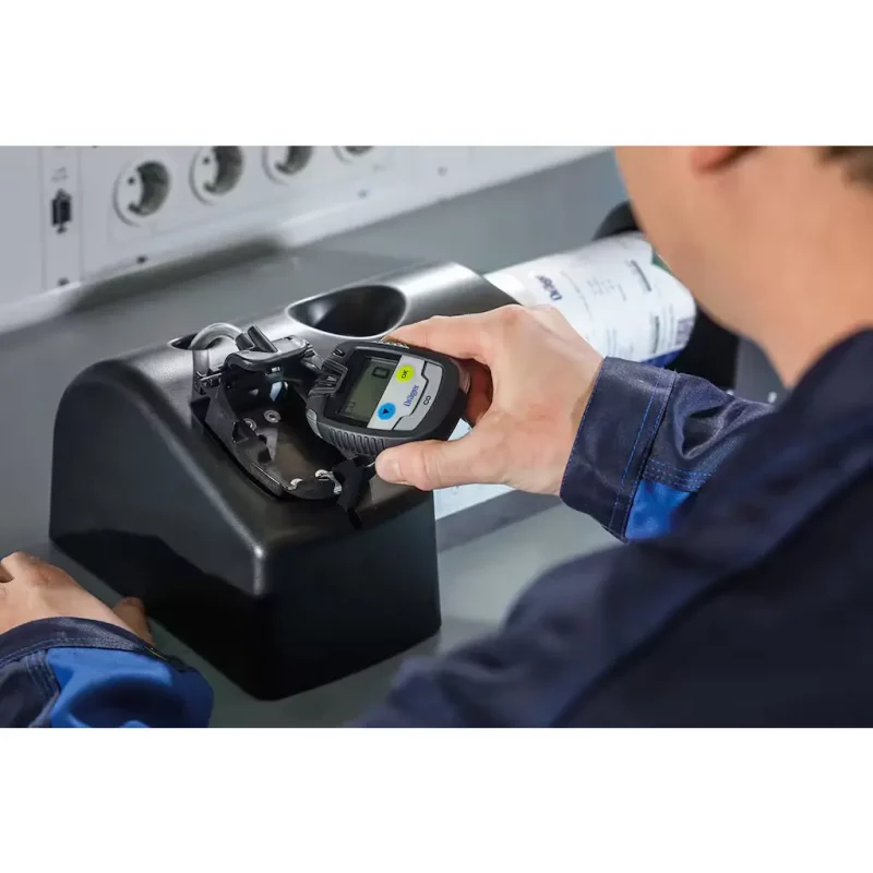 A person holding the Dräger Pac® 6500 Single-Sensor Gas Detector configured for carbon monoxide (CO) detection, showcasing its large backlit display, rugged design, and compact size for reliable portable gas monitoring.