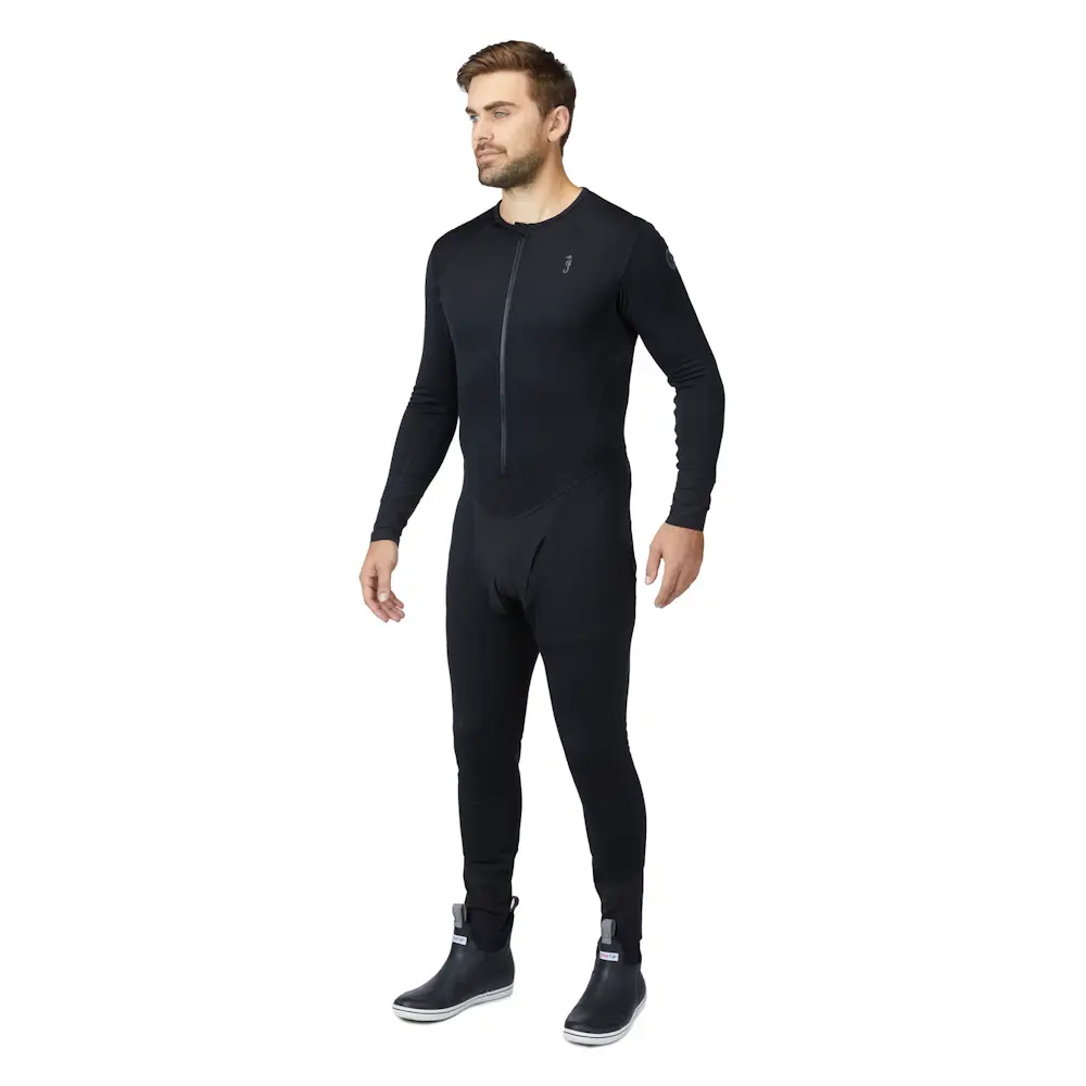 Front-side view of a man wearing Mustang Survival® Men’s Kazan Dry Suit Liner, showcasing tailored fit and thermal fabric designed for comfort and mobility.