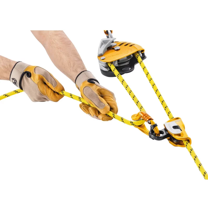 Petzl® MAESTRO® S Descender in use with rope fed and carabiner attached, demonstrating secure rope control and connection for rescue and descent operations.