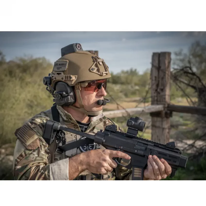 Military soldier armed and wearing Team Wendy® EXFIL® Ballistic SL Helmet during tactical operations, demonstrating advanced protection and mission readiness.