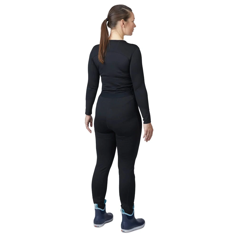 Back-side view of a woman wearing Mustang Survival® Women’s Kazan Dry Suit Liner highlighting ergonomic seam placement and snug fit for optimal insulation.