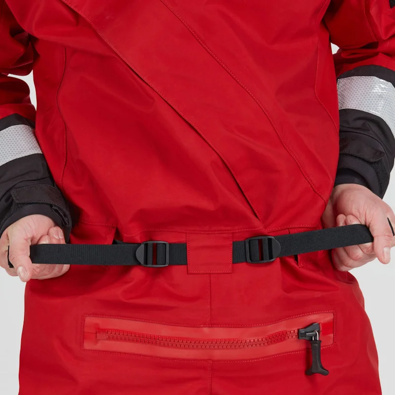 Closeup of a man wearing the NRS Ascent SAR Dry Suit in red, gripping the adjustable waist straps for a secure fit.