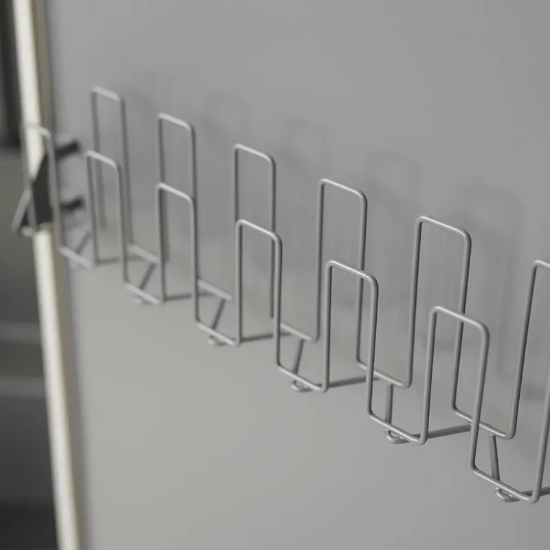 Closeup of glove rack mounted on the door of Ready Rack™ Vortex DC2 Drying Cabinet — 2-Gear, providing organized storage and easy access to firefighting gloves.