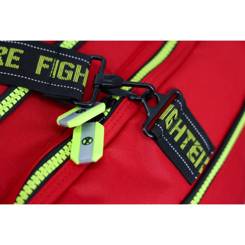 Closeup of zipper located next to carrying strap hook on Lightning X LXFB10 red variant, highlighting secure closure and attachment points.