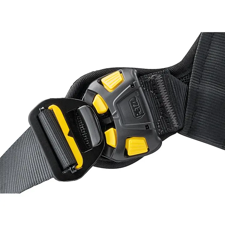 Close-up of the Petzl® AVAO® BOD FAST Harness International Version bottom buckle, highlighting the sturdy metal construction and easy-to-use quick-release mechanism for secure leg loop adjustment.
