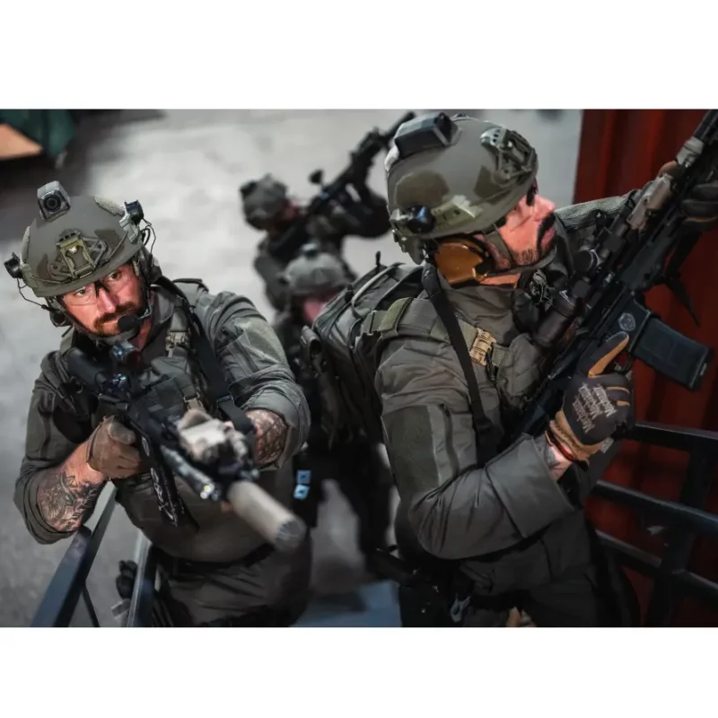 Military soldiers during operation or training wearing Team Wendy® EPIC™ Specialist Ballistic Helmets equipped with tactical gear for enhanced protection and mission readiness.