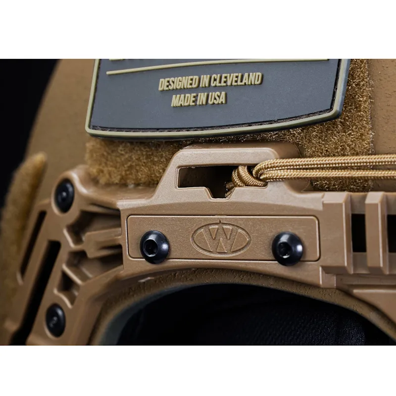 Close-up right side view of the Team Wendy® EXFIL® Ballistic Helmet in coyote brown, detailing the rail attachments, hardware, and rugged surface texture.