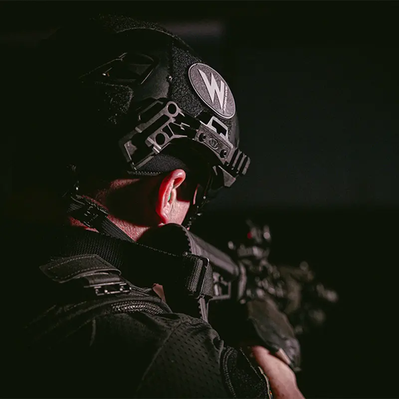 Policeman wearing the Team Wendy® EXFIL® LTP Bump Helmet while armed during a training or response scenario.