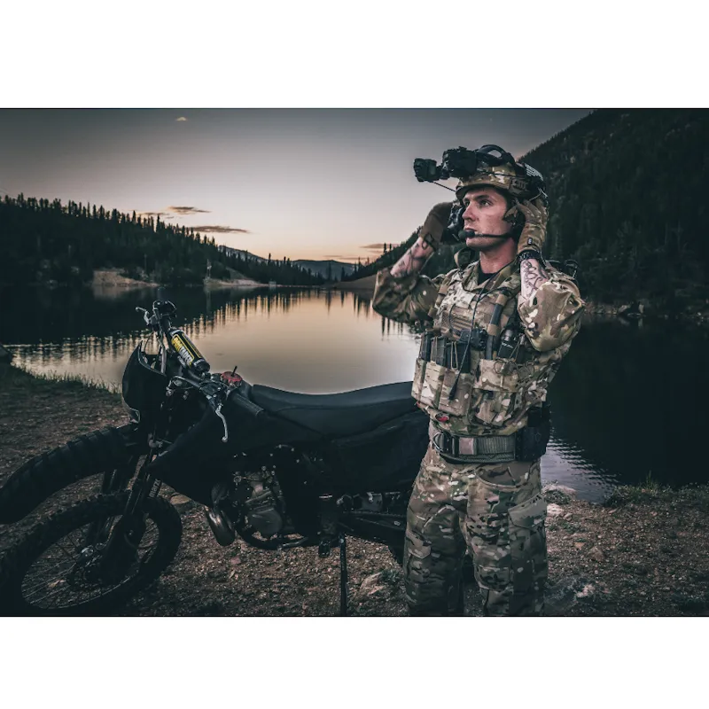 Military soldier wearing the Team Wendy® EXFIL® Ballistic Helmet outside, demonstrating its field-ready fit and compatibility with tactical gear.
