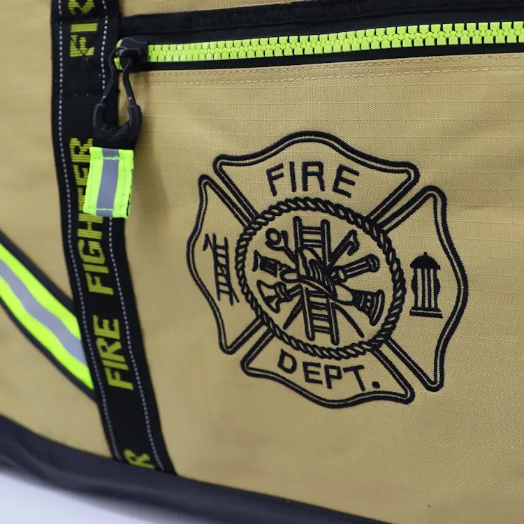 Close-up of Lightning X LXFB10XT 3XL Ripstop Turnout Gear Bag showing custom Fire Department logo embroidery on the side for personalized identification.
