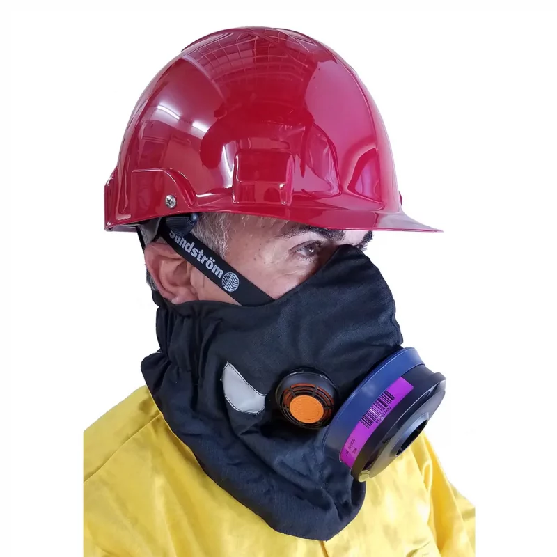 Front left side view of a person wearing the Hot Shield® HS-4 FR Housing, showing full-face coverage with flame-resistant housing securely fitted over the Sundstrom SR-100 respirator for superior heat and fire protection.