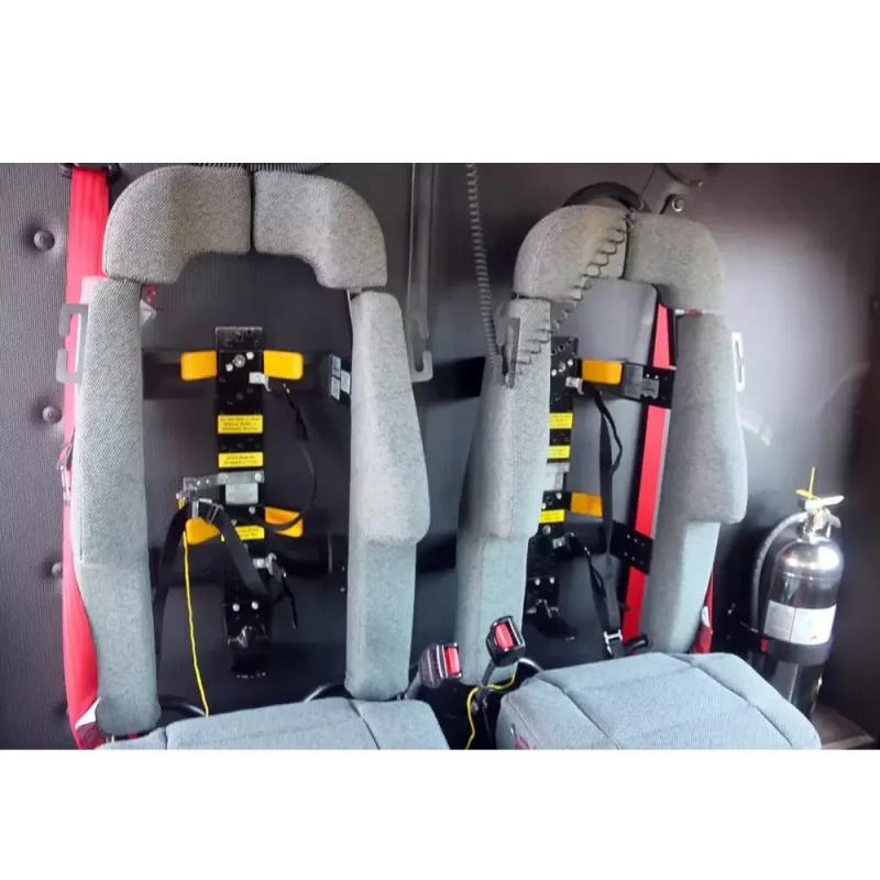 Two empty Ziamatic™ Load & Lock SCBA Brackets mounted on firetruck seats, ready to securely hold self-contained breathing apparatus (SCBA) for emergency response.