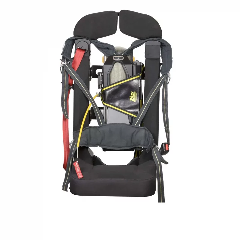Ziamatic™ EZ-OUT SCBA Bracket mounted on a firetruck seat, empty but with SCBA carrying straps attached, ready to securely hold the breathing apparatus for quick deployment.