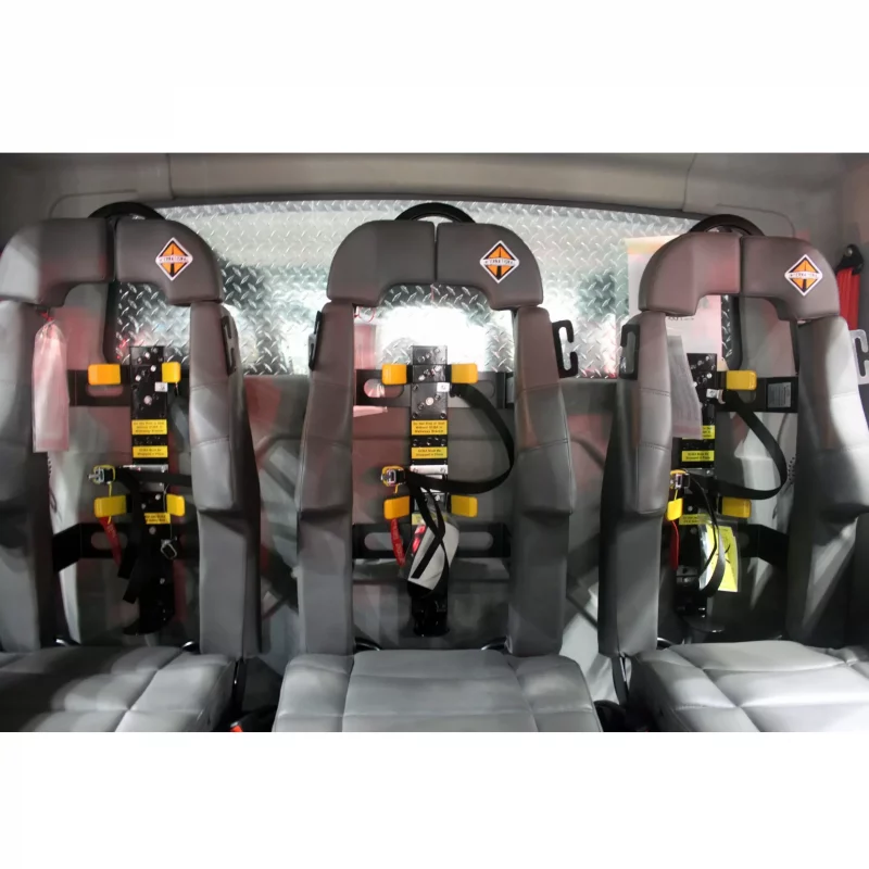 Three empty Ziamatic™ Load & Lock SCBA Brackets mounted on firetruck seats, ready to securely hold self-contained breathing apparatus (SCBA) for emergency response.