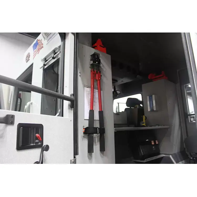 Bolt cutters securely held in Ziamatic™ Bolt Cutter Brackets mounted inside a firetruck, providing organized and accessible storage for emergency use.