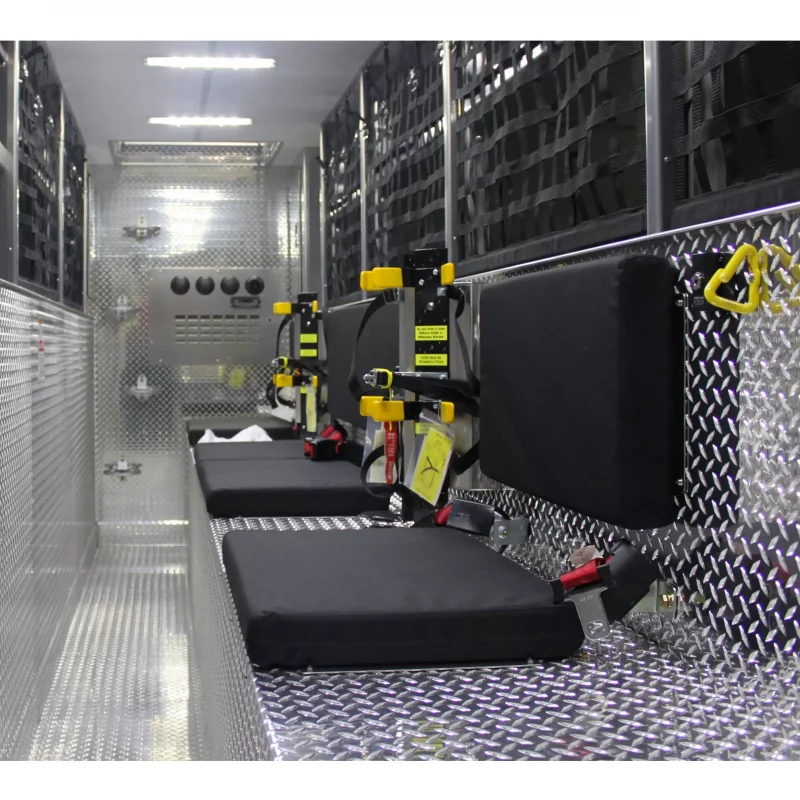 Two empty Ziamatic™ Load & Lock SCBA Brackets installed inside a firetruck, ready to securely hold self-contained breathing apparatus (SCBA) for rapid access during emergencies.