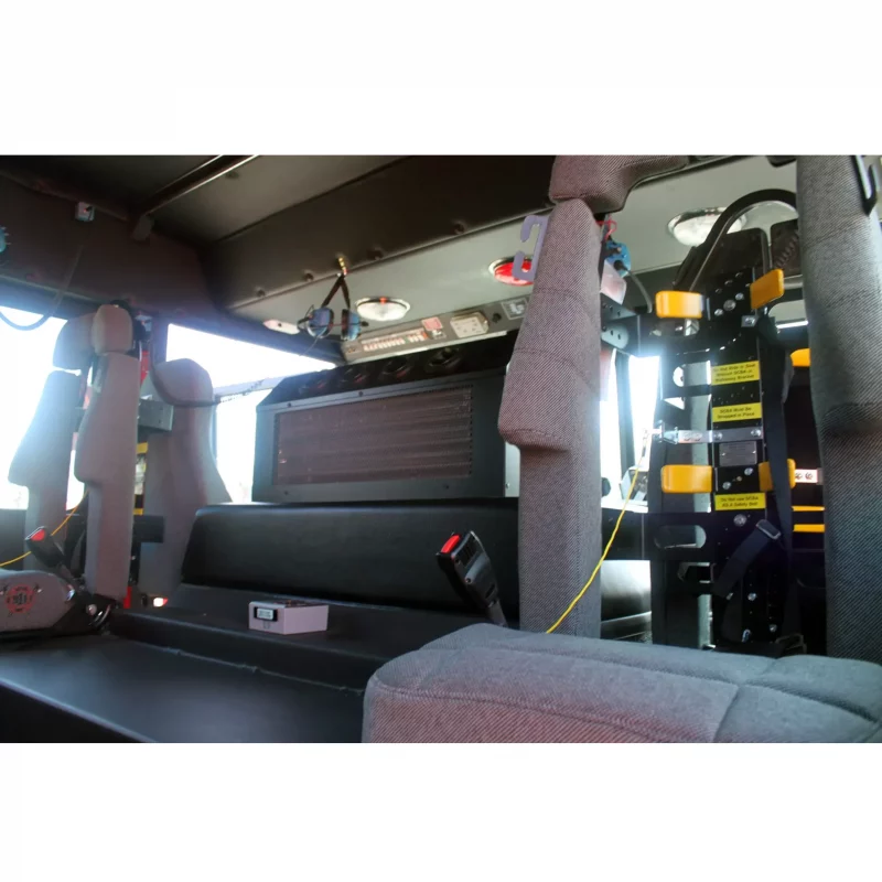 Two empty Ziamatic™ Load & Lock SCBA Brackets positioned far apart on each side at the ends of the firetruck interior, ready to securely hold self-contained breathing apparatus (SCBA) for emergency use.