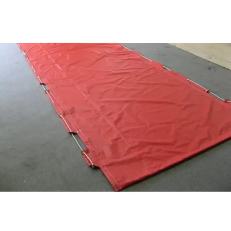 Husky® Hose Bed Covers laid on the ground, displaying their durable material and design for protecting and organizing firefighting hoses during storage and transport.