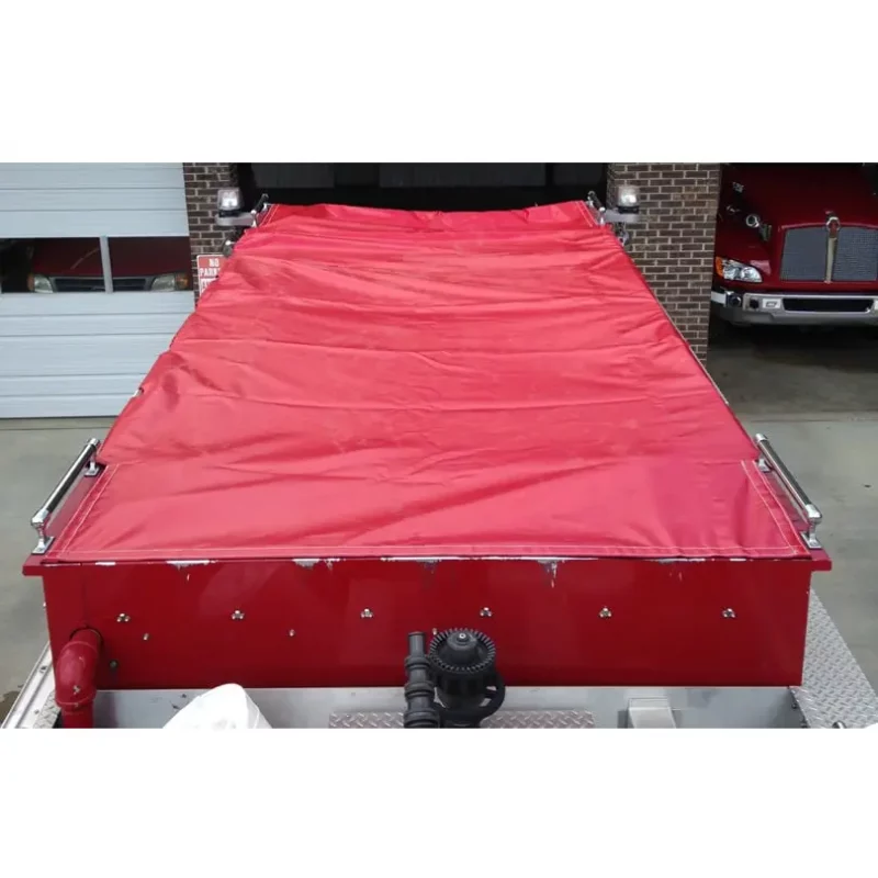 Top view of Husky® Hose Bed Covers installed on a firetruck, showing their full coverage and secure fit to protect firefighting hoses during emergency response.