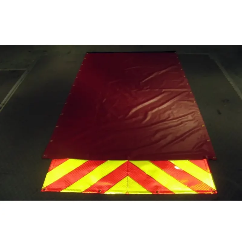 Top view of Husky® Hose Bed Covers laid flat on the ground, highlighting their durable construction and size designed to protect firefighting hoses during storage and transport.