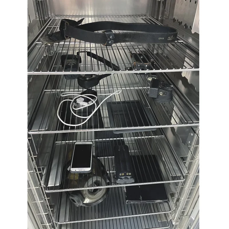 Close-up inside the Cres Guard® Mobile Decontamination UVC + Heat unit with the door open, revealing the UVC lamps and heating components used for thorough equipment disinfection.
