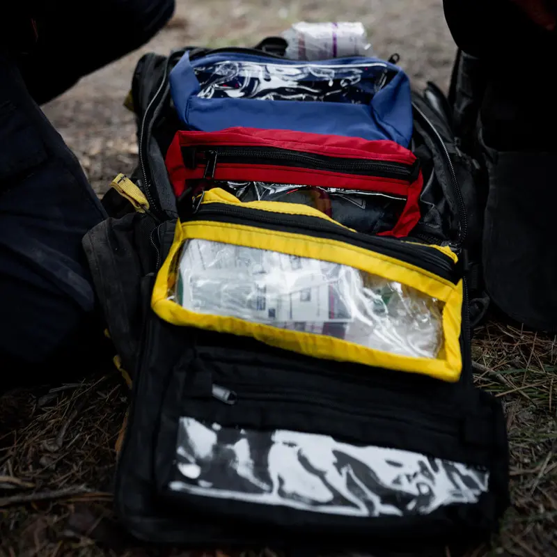 Alternate angle of the opened True North Gear Firefly™ Medic Pack displaying neatly arranged medical gear in its divided compartments, emphasizing quick accessibility and efficient organization in critical response situations.