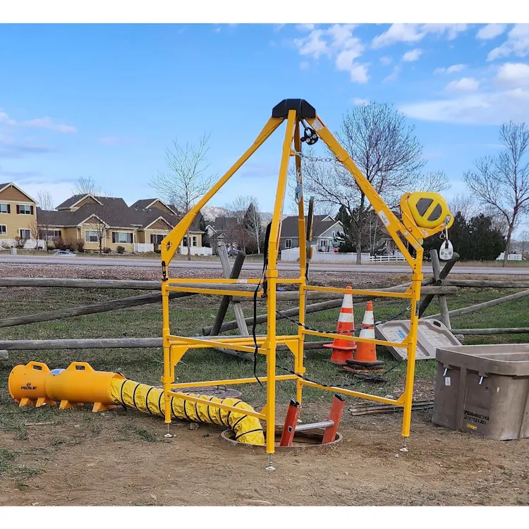 Pelsue® LifeGuard Confined Space Safety System installed outdoors over a manhole in use, providing confined space entry, rescue, and fall protection for industrial safety operations.