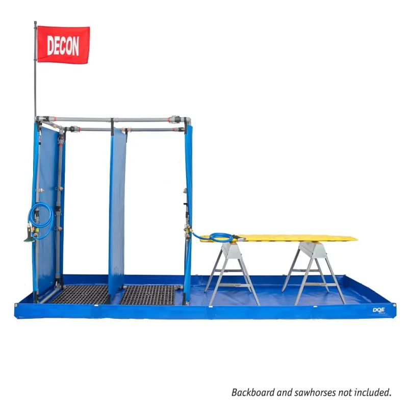 DQE® MasCas® II Decontamination Shower System with table extended, showing the portable mass decontamination unit configured for rapid multi-person use during emergency response operations.