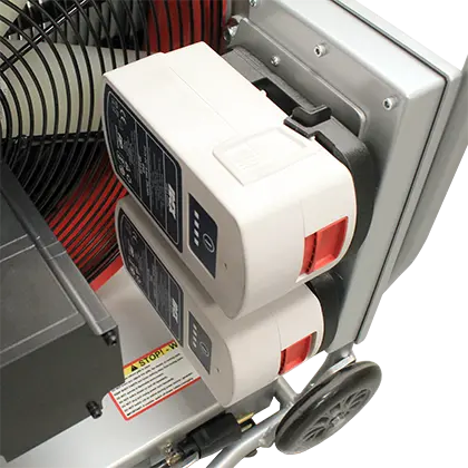 Close-up of the battery compartment on the Tempest VS-1.3H Tech Series Positive Pressure Blower, showing the dual HURST® battery setup for reliable cordless operation.