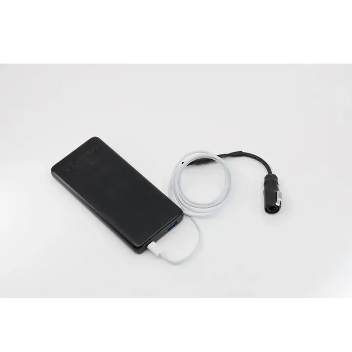 NightRide Trailblazer Portable Battery Cable with 2-pin connector plugged into a power bank for mobile thermal imaging device power.