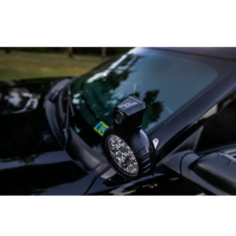 Close-up of NightRide PRO-SL S04 384/640 thermal camera mounted on police car, highlighting detailed housing and mounting hardware.